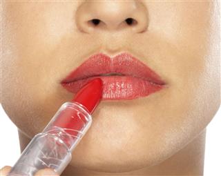 Girl Applying Lipstick