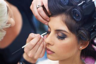 Hairdresser Applying Eye Makeup