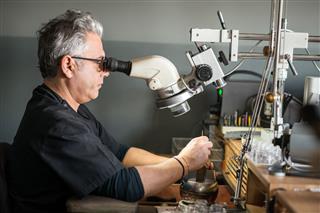 Jewelry Craft Laboratory Man Working With Microscope