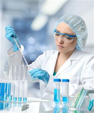 Female Scientist Works In Laboratory