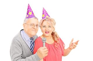 Middle Aged Couple With Party Hats