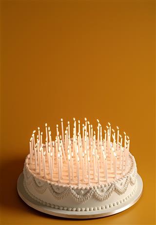 Cake with lighted candles