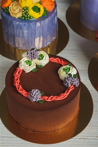 Chocolate brown cake with cream decoration