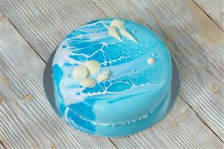 Blue cake maritime-style decorated closeup