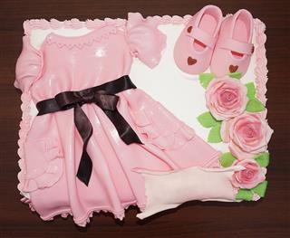 Pink dress cake with shoes and flowers for christening baptism