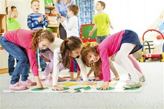 Children Playing Floor Game