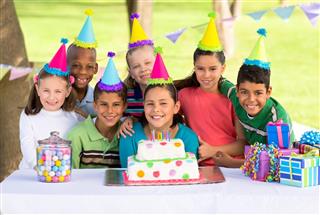 Multiethnic children celebrating a birthday