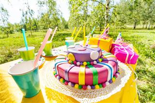Close-up picture of birthday cake on festive table