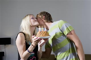 Couple with birthday cake