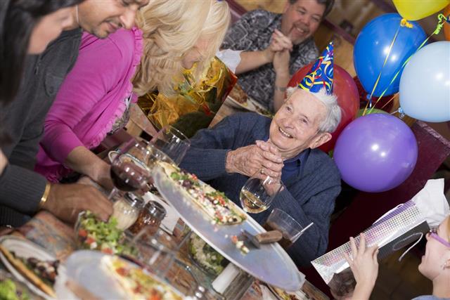 Birthday party of 90-year old man at a pizza restaurant