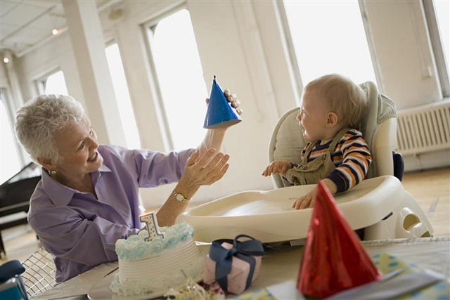 Grandmother with party hat for grandson