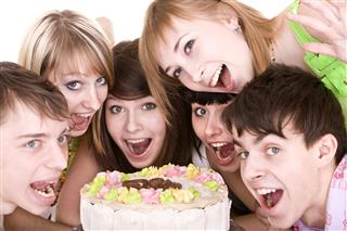 Group of teenagers celebrate birthday
