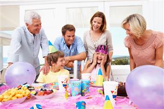 Family At A Girls Birthday Party