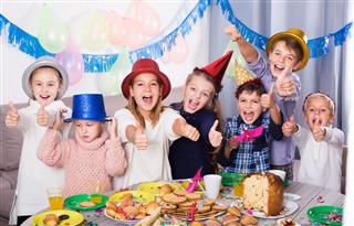 Satisfied children having party friends birthday
