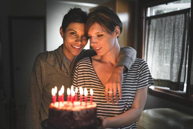 Lesbian couple share the kiss for the birthday