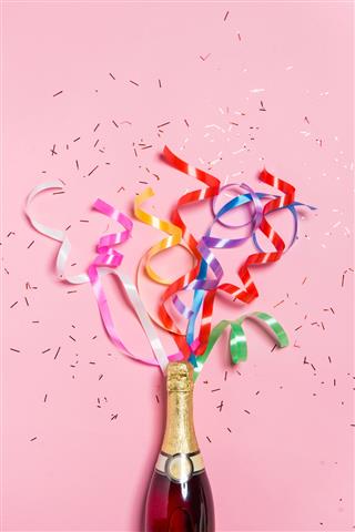 Champagne Bottle With Colorful Party Streamers