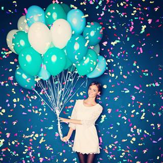 Cheerful Woman With Balloons And Confetti
