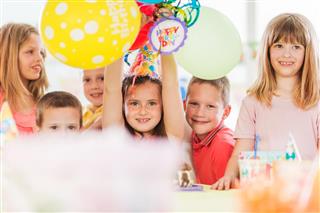 Group of happy children celebrating a birthday