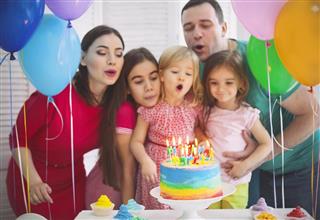 Portrait of a family celebrating birthday