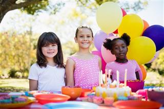 Cute girls smiling and posing during a birthday party