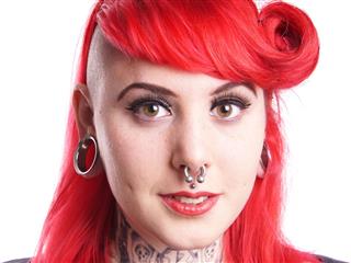 Woman With Red Hair And Piercings