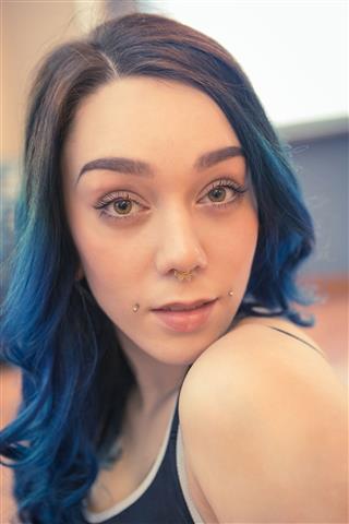 Tattooed Young Woman With Blue Hair