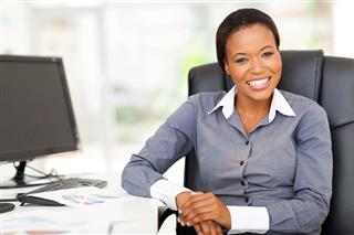 African Businesswoman Sitting In Office