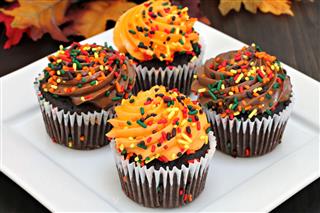 Cupcakes With Orange And Chocolate Frosting