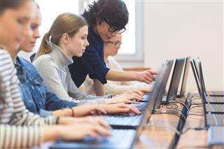 Female Students Learning Computer Programming