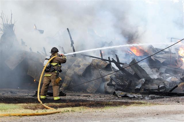 Firefighter Fighting Barn Explosion