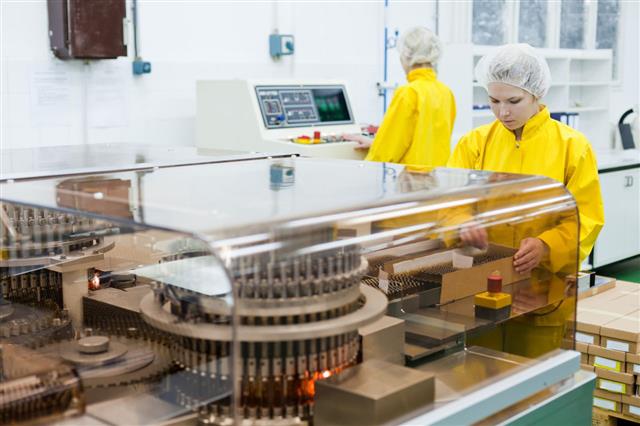 Woman Working At The Pharmaceutical Factory