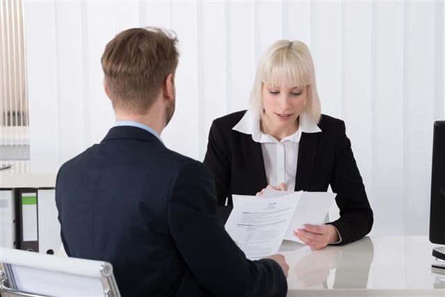 Businesswoman Discussing On Resume