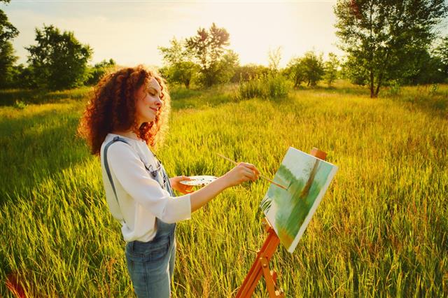 Young Woman Painting Landscape