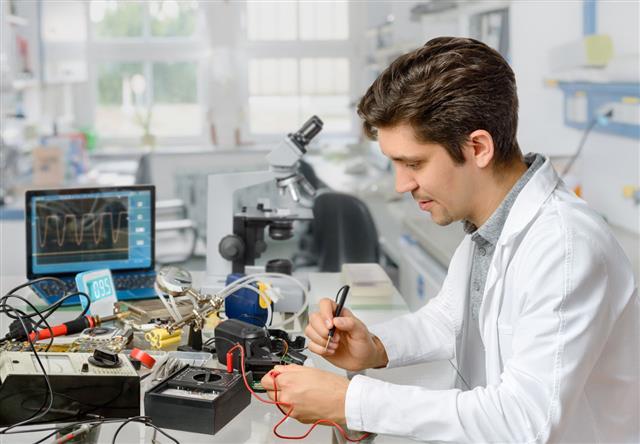Engineer Repairs Electronic Equipment