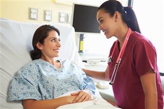 Nurse Talking To Female Patient