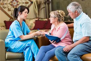 Concerned Senior Patient Talks With Nurse
