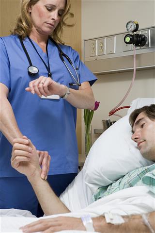 Doctor Checking Patients Pulse