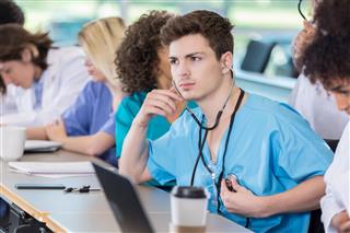Medical Student Uses Stethoscope In Class