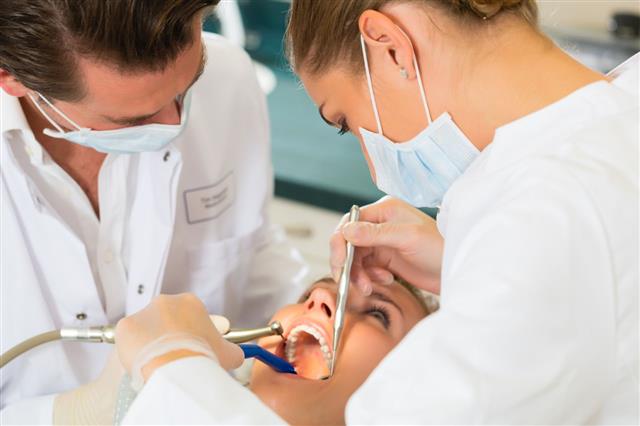 Patient With Dentist Dental Treatment