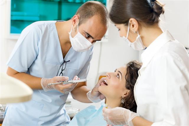 Dentist Preparing Patient For Anesthesia