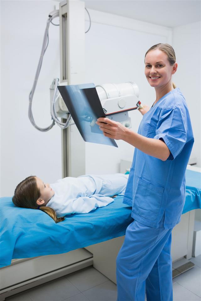 Smiling Nurse Holding X Ray