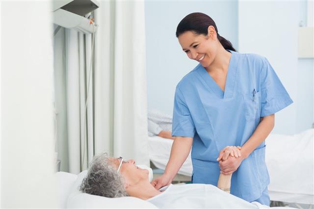 Nurse Holding The Hand Of Patient