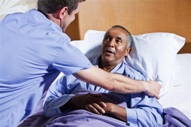 Male Nurse Helping Senior Patient