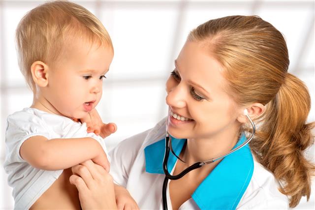 Doctor Pediatrician Listens To Heart