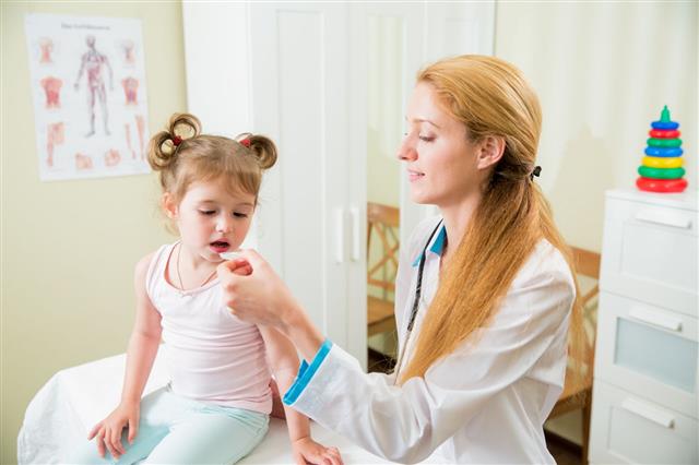 Pediatrician Giving Medicament To Little Girl
