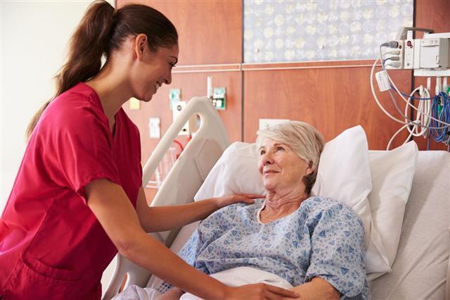 Nurse Talking To Senior Female Patient