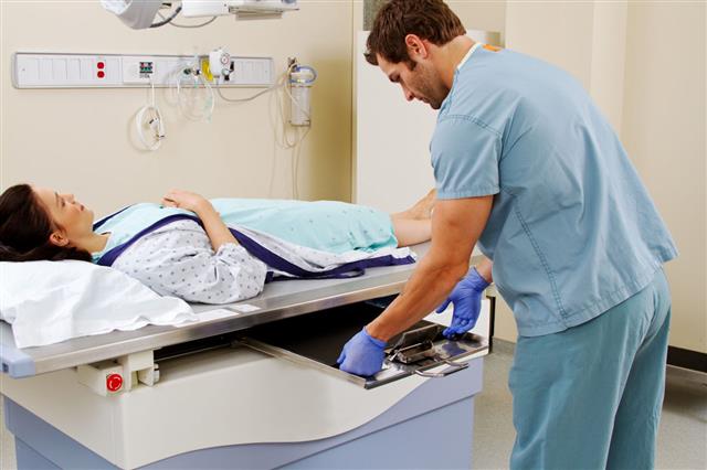 Technician Inserting Plate For X Ray