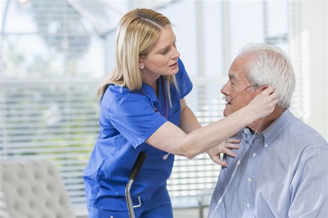 Nurse Helping Elderly Man With Oxygen