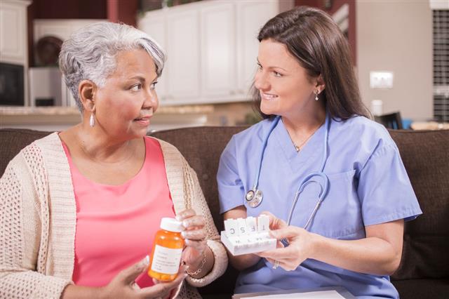 Home Healthcare Nurse Giving Medications