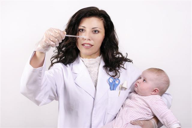 Doctor With Baby Health Care Checkup